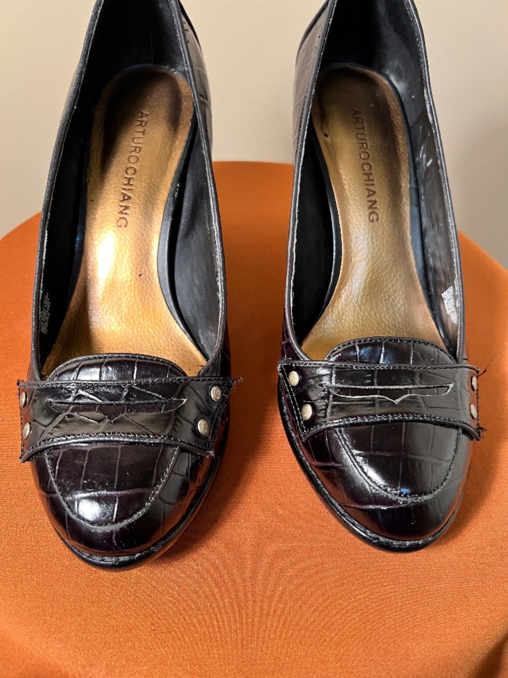 Black reptilelike leather loafer style pumps